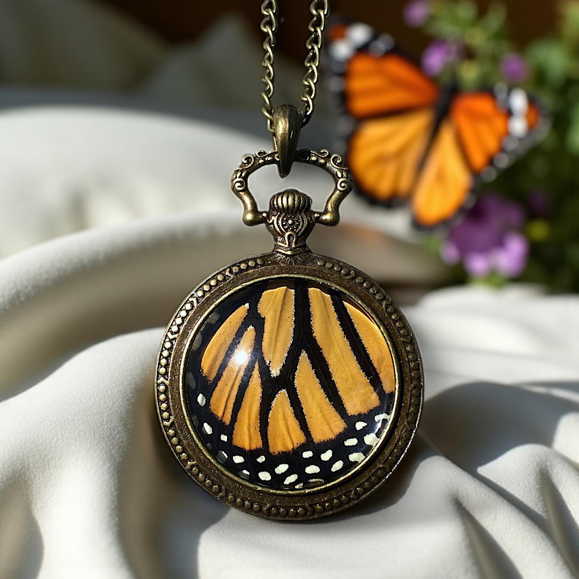 Real monarch butterfly wing necklace Ethically sourced taxidermy jewelry Steampunk pocket watch style necklace Pressed flower necklace
